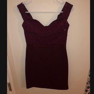 Off the shoulder fancy maroon dress.